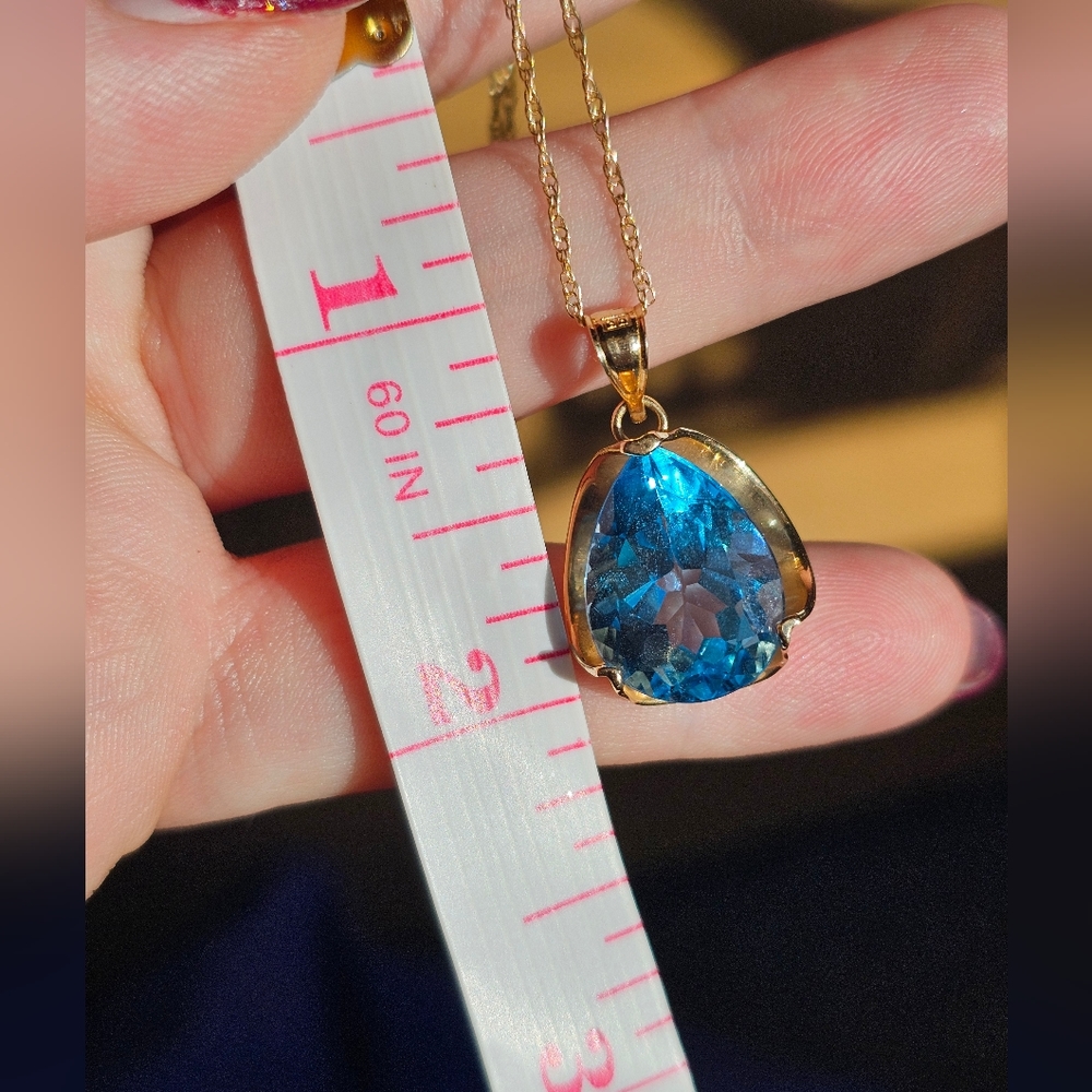 14k HUGE blue topaz necklace! Stamped 14k on chain and pendant. Pear shaped genu